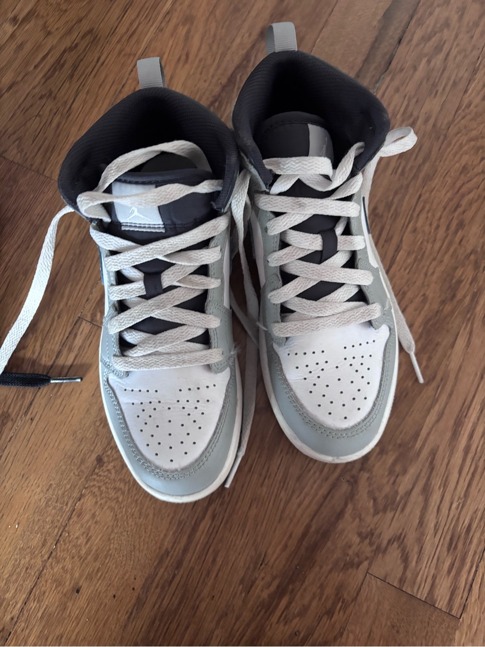 Kids Jordan 1s Neutral Gray & White Mid-Top Sneakers